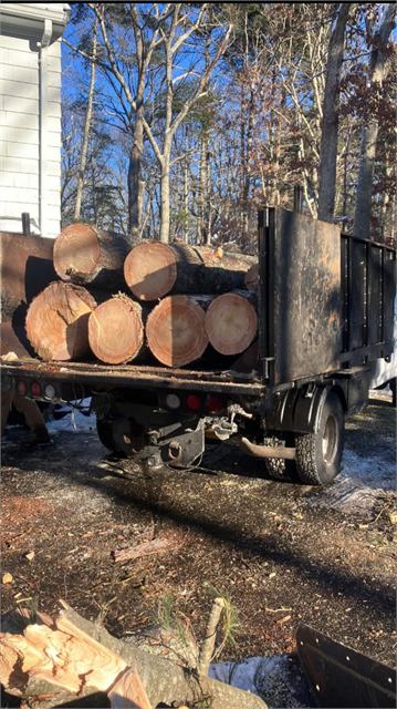 Truck loaded with hardwood log rounds